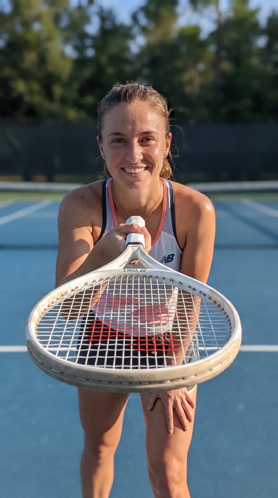 The finished user-generated-content frame: a player on court holding the racquet at golden hour