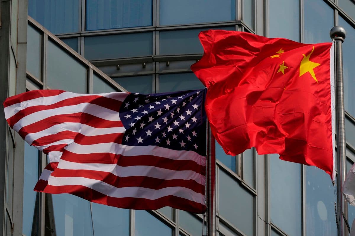 The Latest: Trump arrives in China to meet with Xi in Beijing